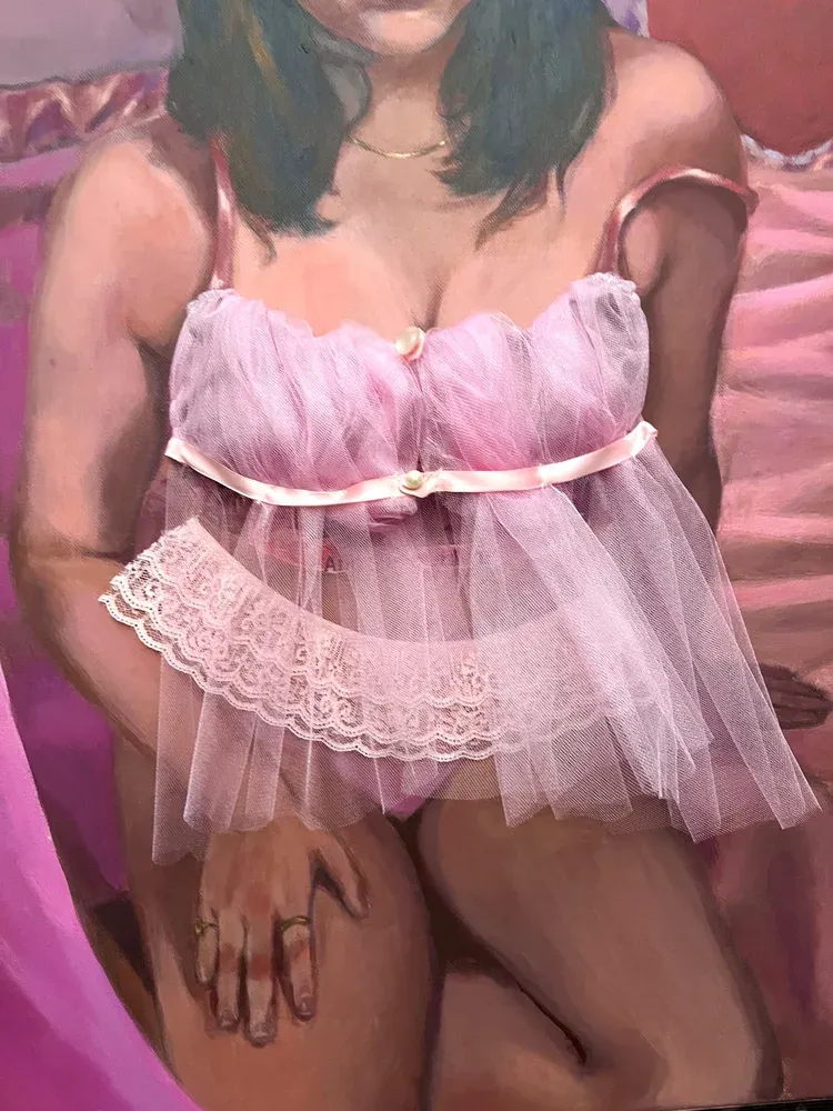 Woman sitting in lingerie on the bed