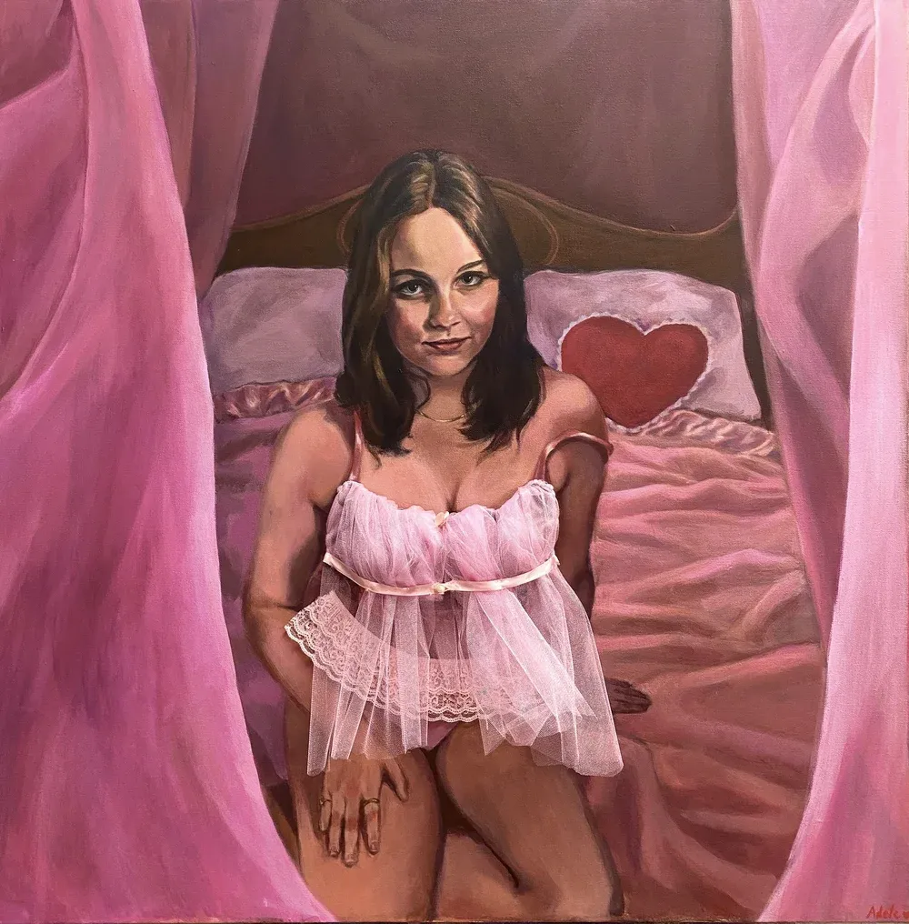 Woman sitting in lingerie on the bed