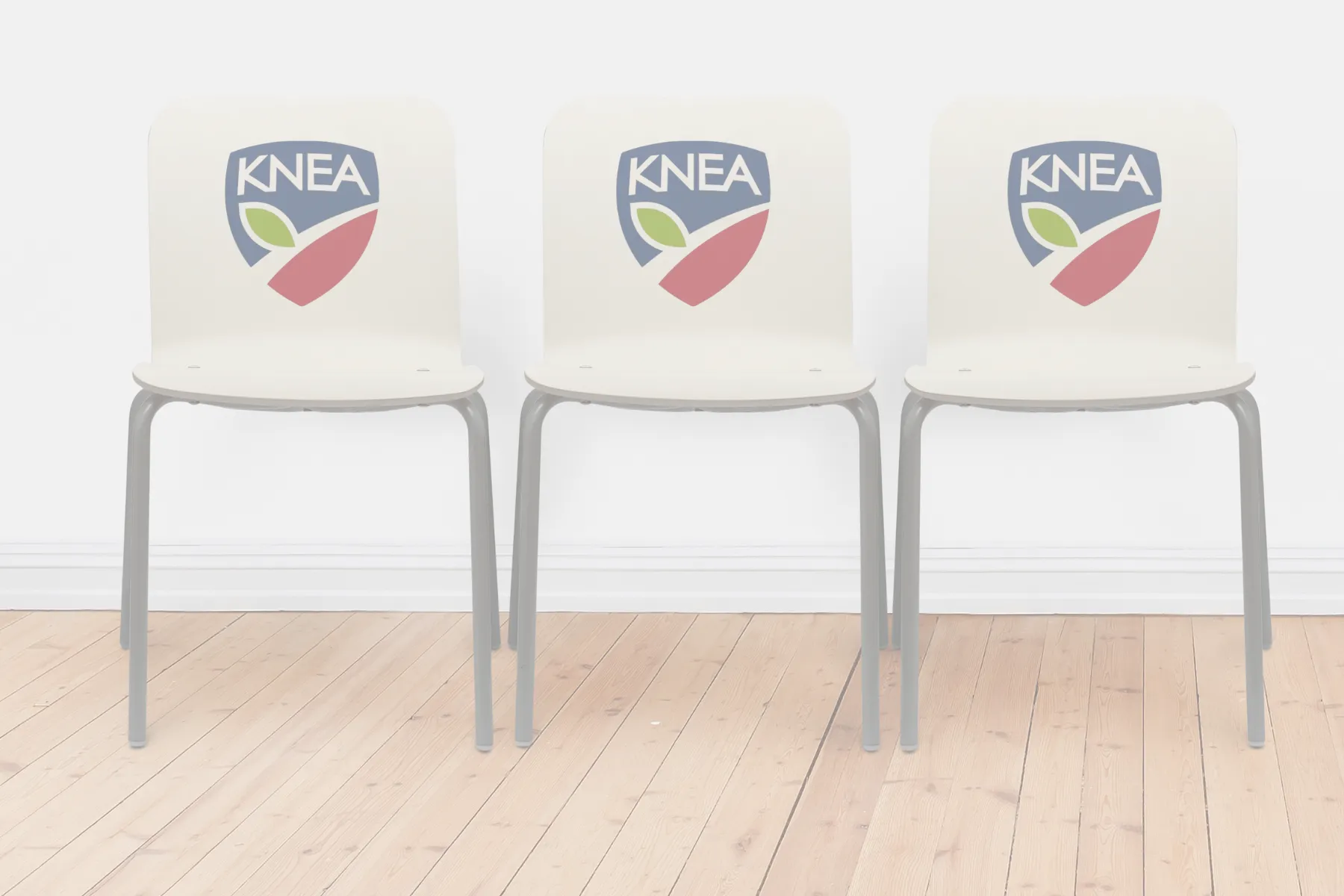 Three chairs with KNEA logos.