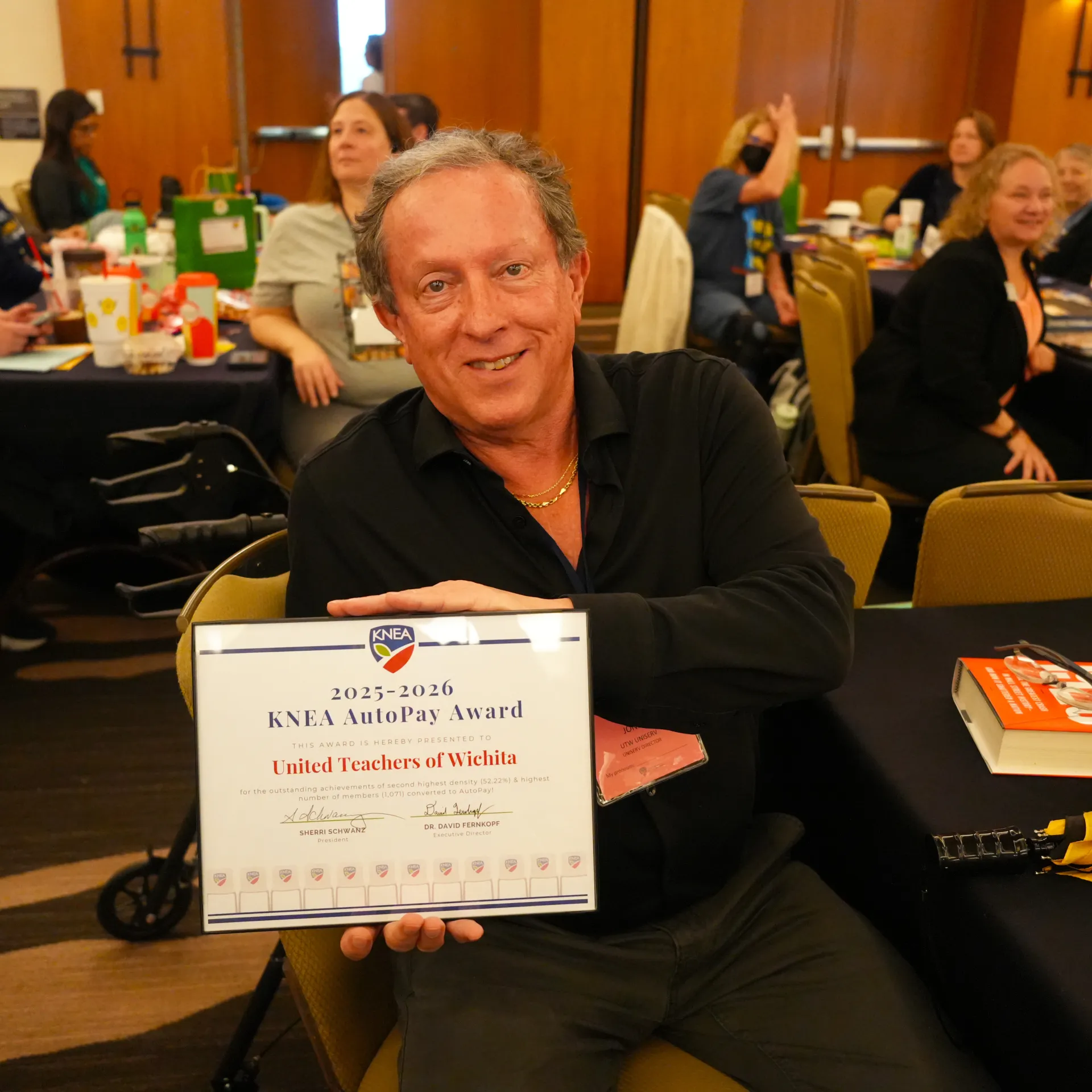 Man holding an award