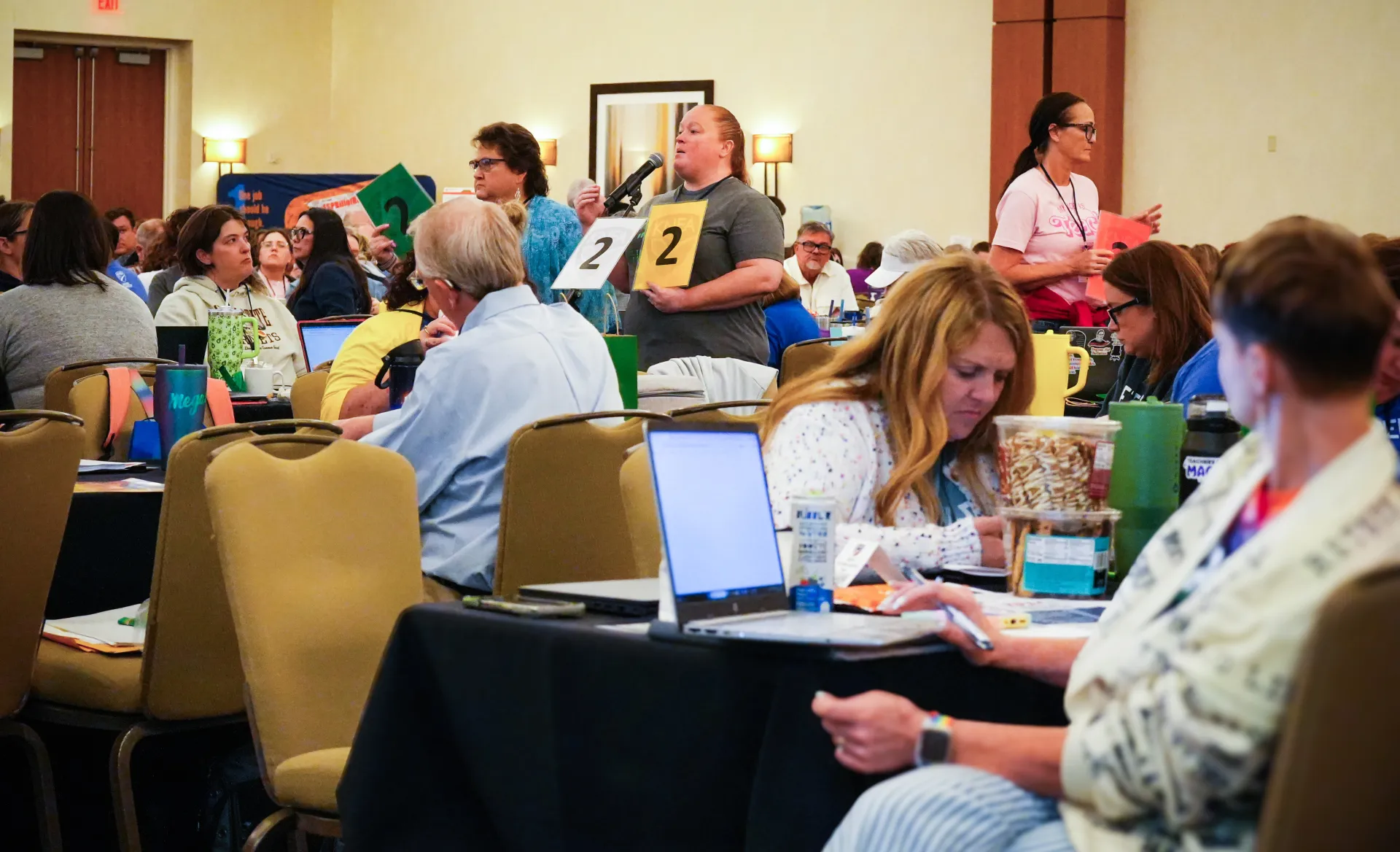 KNEA Representative Assembly Delegates at the microphone during the 2026 KNEA RA in Wichita.