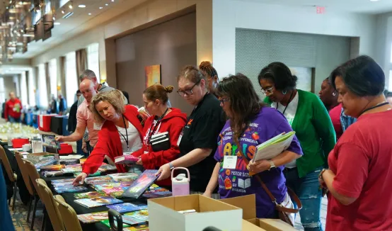 Delegates at the 81st annual KNEA Representative Assembly (RA) selected free books in April 2026 as part of the KNEA Reading Circle's 100th anniversary.