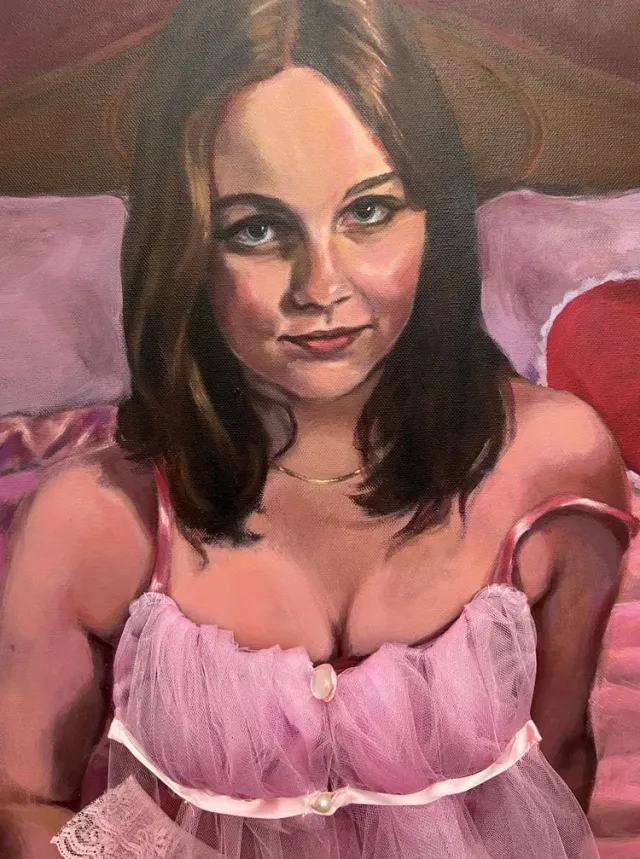 Woman sitting in lingerie on the bed