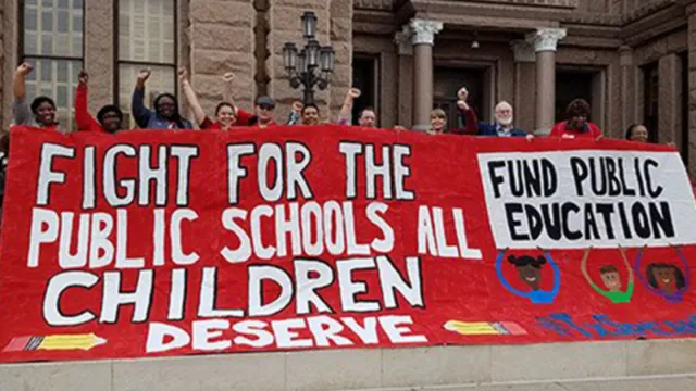 education advocates pose with a large banner demanding school funding