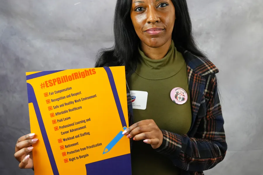 A woman holds the ESP Bill of Rights
